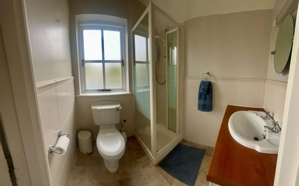 Bathroom with shower cubicle and window