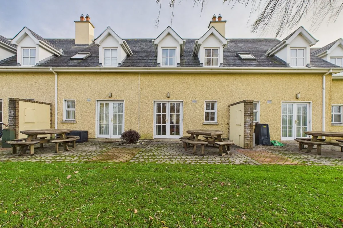 Rear of the house with patio and lawn